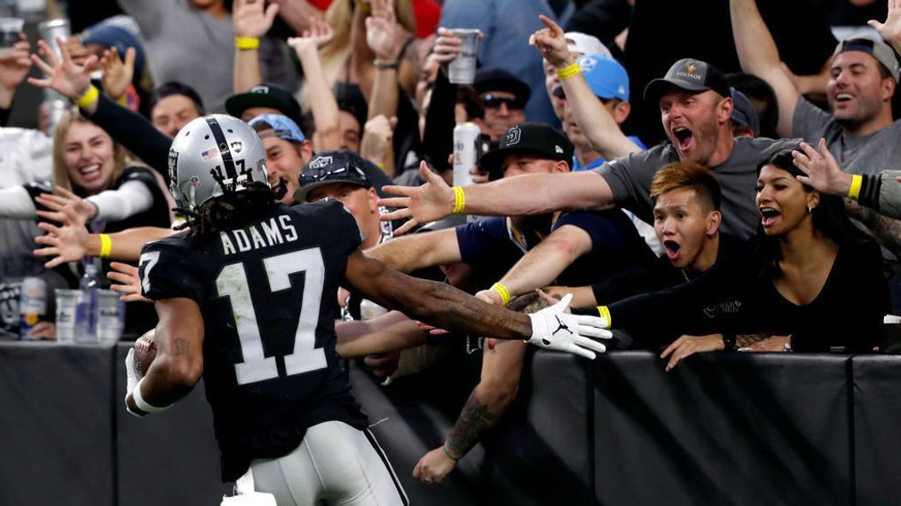 LAS VEGAS, NEVADA - DECEMBER 04: Davante Adams #17 of the Las Vegas Raiders celebrates with fans after scoring a touchdown in the third quarter against the Los Angeles Chargers at Allegiant Stadium on December 04, 2022 in Las Vegas, Nevada. (Photo by Steve Marcus/Getty Images)