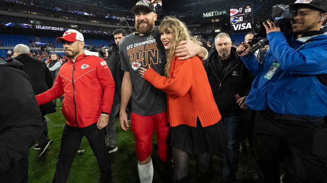 FILE - Kansas City Chiefs tight end Travis Kelce walks with Taylor Swift following the AFC Championship NFL football game between the Baltimore Ravens and the Kansas City Chiefs in Baltimore on Jan. 28, 2024. The Chiefs won 17-10. (AP Photo/Julio Cortez, File)