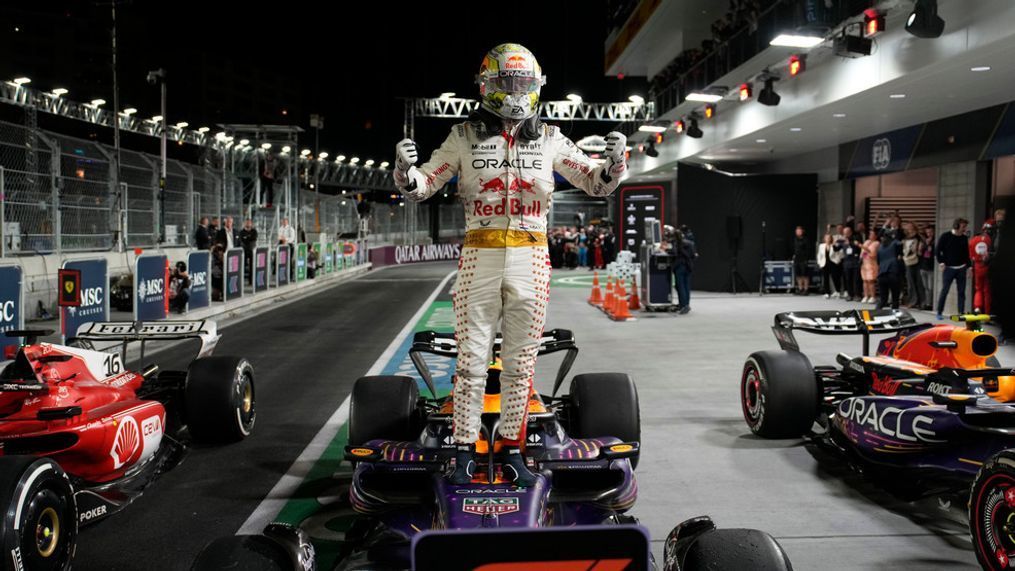 Red Bull driver Max Verstappen, of the Netherlands, stands on top of his car after winning the Formula One Las Vegas Grand Prix auto race, Saturday, Nov. 18, 2023, in Las Vegas. (AP Photo/John Locher)