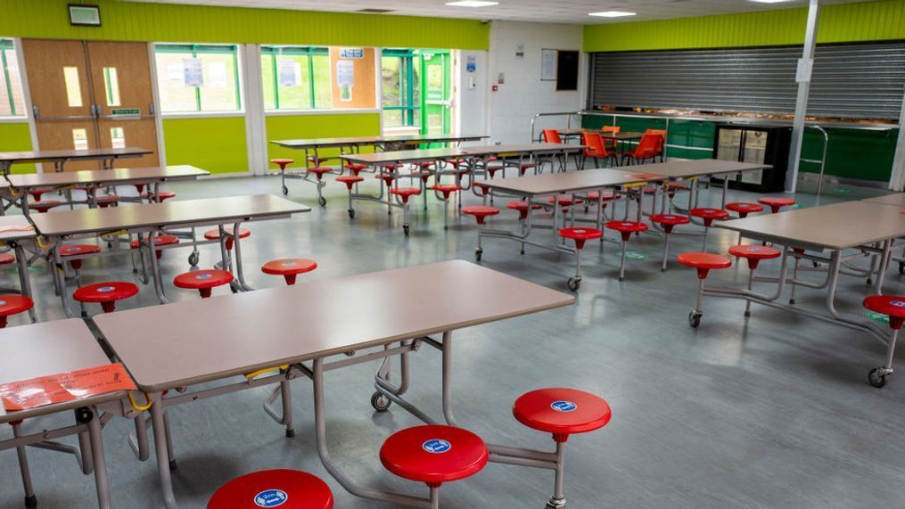 A photo of an empty school cafeteria (Photo by Anthony Devlin/Getty Images).