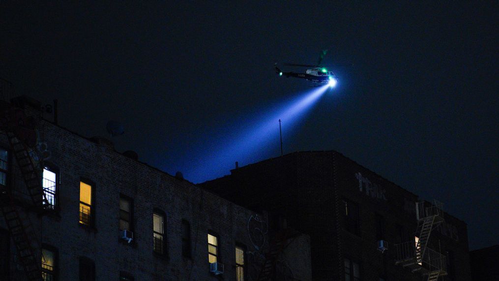 A New York City Police Department helicopter patrols the area after a shooting at the Mount Eden Avenue subway station, Monday, Feb. 12, 2024, in the Bronx borough of New York. (AP Photo/Eduardo Munoz Alvarez)