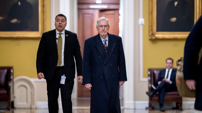 Senate Minority Leader Mitch McConnell, R-Ky., right, arrives as the Senate moves closer to a final vote on an emergency spending package that would provide military aid to Ukraine and Israel, replenish U.S. weapons systems and provide food, water and other humanitarian aid to civilians in Gaza, at the Capitol in Washington, Monday, Feb. 12, 2024. (AP Photo/J. Scott Applewhite)